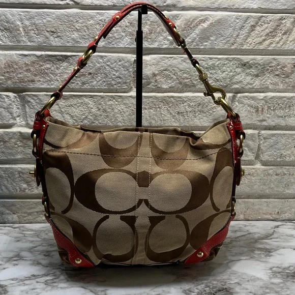 Coach Carly Signature Hobo Bag with red leather trim and gold-tone hardware. - Picture 7 of 14